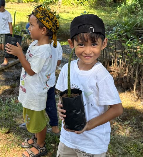 Children planting mangroves