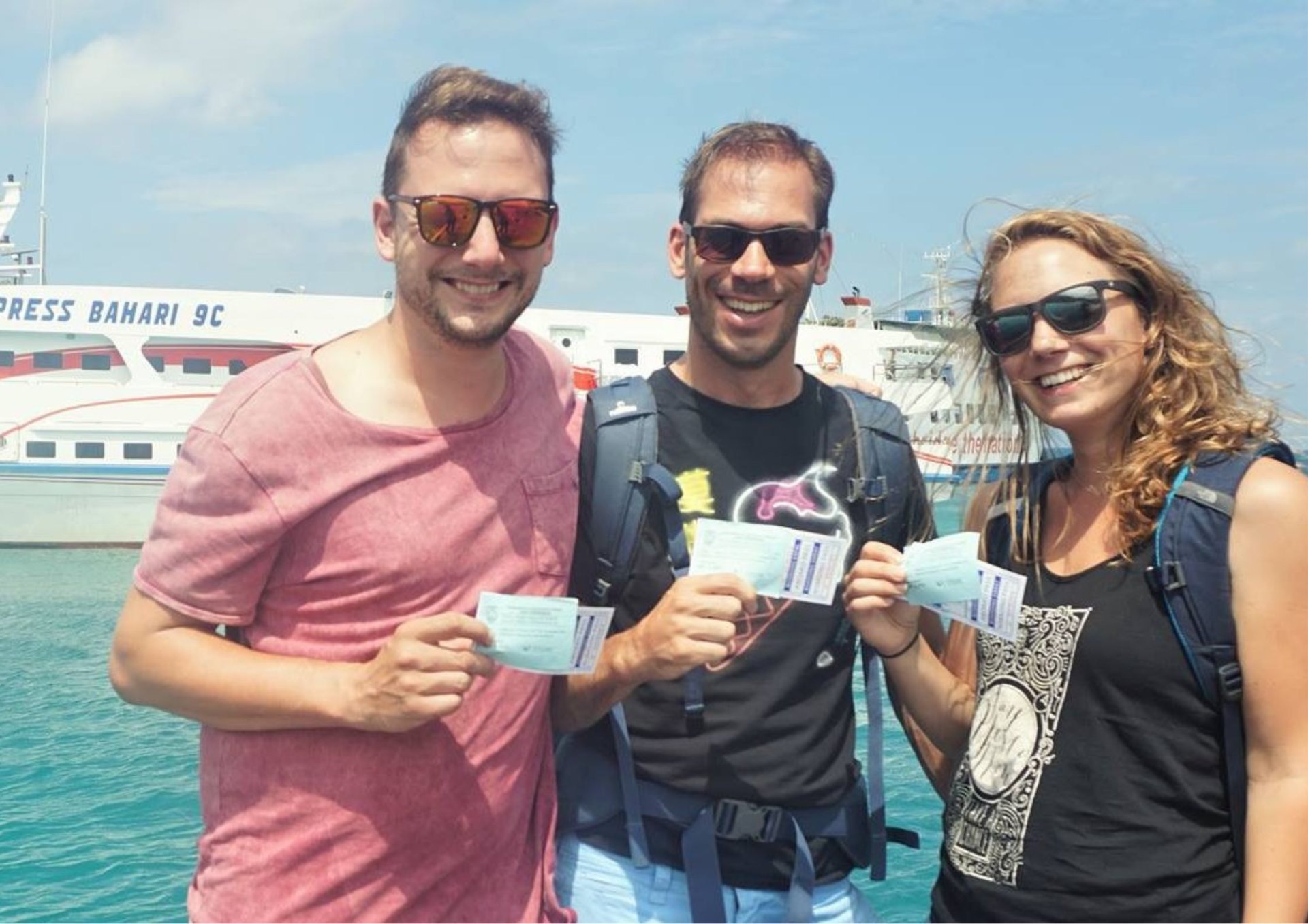 Travellers with Bahari Express boat tickets at Jepara harbour